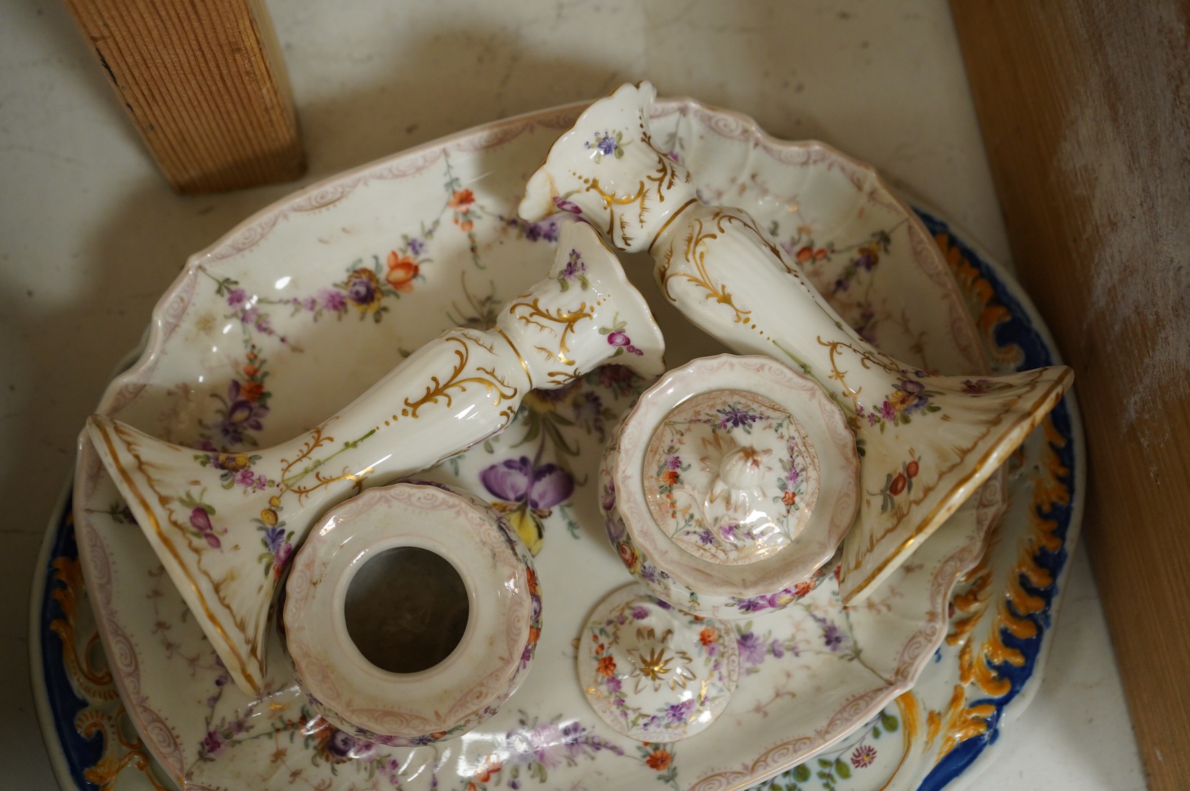 A late 19th century Dresden ink stand and a pair of candlesticks and a Nove faience dish